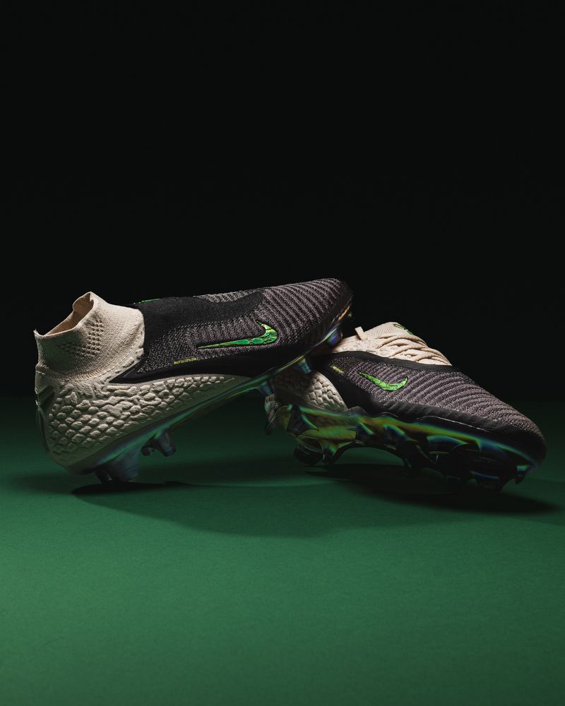 Nike Phantom boots in black and cream on green, low side light